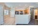 Bright kitchen featuring wooden cabinets, tiled floors, and modern appliances at 1142 Heavenly Harvest Pl # 2, Henderson, NV 89002