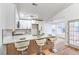 Well-lit kitchen featuring a breakfast bar with seating and updated appliances at 1183 Winnipeg Ct, Henderson, NV 89002