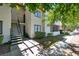 Exterior building view featuring a staircase and a grassy courtyard at 1701 E Katie Ave # 21, Las Vegas, NV 89119