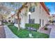 Exterior building view featuring grassy area, small bushes, and small tree at 1701 E Katie Ave # 21, Las Vegas, NV 89119