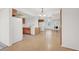 Open kitchen featuring white appliances and oak cabinets, adjacent to living room at 1701 E Katie Ave # 21, Las Vegas, NV 89119