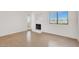 Bright living room features a fireplace and large window, offering abundant natural light at 1701 E Katie Ave # 21, Las Vegas, NV 89119