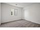 Cozy bedroom with carpet, white walls, a window, and a closet with sliding doors at 1709 Desert Path Ave, North Las Vegas, NV 89032
