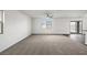 Spacious living room with gray carpet, white walls, and lots of natural light at 1709 Desert Path Ave, North Las Vegas, NV 89032