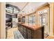 Spacious kitchen featuring a large island with bar stool seating, pantry and stainless steel appliances at 1801 Glory Creek Dr, Las Vegas, NV 89128