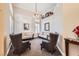 Stylish living room with high ceilings, decorative wall paneling, comfortable seating, and elegant decor at 1801 Glory Creek Dr, Las Vegas, NV 89128