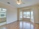 Open, airy bedroom featuring a connecting bathroom and a large window with neighborhood views at 1808 Eagle Village Ave, Henderson, NV 89012