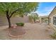 Wide backyard with gravel landscaping, covered patio, ideal for outdoor living and entertainment at 2084 Fort Halifax St, Henderson, NV 89052