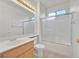 The bathroom features a vanity with a light wood cabinet and a shower tub combo at 2084 Fort Halifax St, Henderson, NV 89052