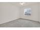 A bright, clean bedroom with neutral carpet, ceiling fan and views of the outside at 2084 Fort Halifax St, Henderson, NV 89052