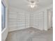 This bedroom features custom built in shelving and neutral carpet at 2084 Fort Halifax St, Henderson, NV 89052