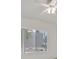 This bedroom features a neutral carpet, a ceiling fan, and a window at 2084 Fort Halifax St, Henderson, NV 89052