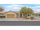 Inviting single-story home featuring a neat front yard with xeriscape landscaping and an attached garage at 2084 Fort Halifax St, Henderson, NV 89052