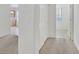 Hallway leading to a carpeted room with a window and natural light at 2084 Fort Halifax St, Henderson, NV 89052