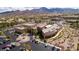 Stunning aerial view of a community center with ample parking, landscaping and mountain views at 2156 Twin Falls Dr, Henderson, NV 89044