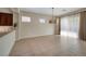 Bright dining area featuring tile flooring and a modern pendant light fixture at 2156 Twin Falls Dr, Henderson, NV 89044