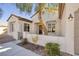 Inviting front entrance features a quaint courtyard and wrought iron gate at 2156 Twin Falls Dr, Henderson, NV 89044