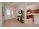 Open foyer featuring tile flooring, a decorative table, and views of the kitchen and front door at 2156 Twin Falls Dr, Henderson, NV 89044