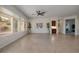 Open living room with neutral paint, tile flooring, and view of the backyard at 2156 Twin Falls Dr, Henderson, NV 89044