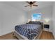 Inviting bedroom with natural light, ceiling fan, and a cozy bed, ideal for relaxation and rest at 2302 Wagonwheel Ave, Las Vegas, NV 89119