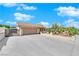Single story home features a desert front yard, two-car garage, and gated RV parking at 2302 Wagonwheel Ave, Las Vegas, NV 89119