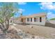 Charming single story home with decorative shutters and desert landscaping in front yard at 2302 Wagonwheel Ave, Las Vegas, NV 89119