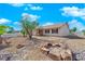 Well-maintained front yard with desert landscaping, enhancing the home's curb appeal and inviting atmosphere at 2302 Wagonwheel Ave, Las Vegas, NV 89119