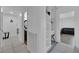Bright hallway with open shelving and seamless transition to various living spaces in the home at 2302 Wagonwheel Ave, Las Vegas, NV 89119