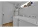 Clean and functional laundry room with modern washer and dryer, and storage shelving at 2302 Wagonwheel Ave, Las Vegas, NV 89119