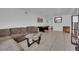 Spacious living area with tile floors, a comfortable couch, and bright neutral paint at 2302 Wagonwheel Ave, Las Vegas, NV 89119