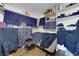 Organized storage area featuring white shelves and blue linens, providing ample space for household items at 2302 Wagonwheel Ave, Las Vegas, NV 89119