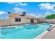 Sparkling swimming pool with built-in steps and a covered patio, perfect for relaxation and entertaining at 2302 Wagonwheel Ave, Las Vegas, NV 89119