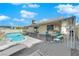 Beautiful backyard featuring a swimming pool with a diving board, a covered patio, and lounge chairs at 2302 Wagonwheel Ave, Las Vegas, NV 89119