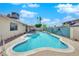 Lush backyard with a refreshing swimming pool, perfect for hot summer days and features desert landscaping at 2302 Wagonwheel Ave, Las Vegas, NV 89119