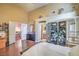 Spacious bedroom with hardwood floors, vaulted ceilings, folding screen and an entry to the bathroom at 2700 Brienza Way, Las Vegas, NV 89117