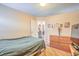 Comfortable bedroom features wood floors, neutral paint, and a dresser at 2700 Brienza Way, Las Vegas, NV 89117