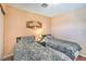 Charming bedroom with two twin beds, wood floors, and a sliding door closet at 2700 Brienza Way, Las Vegas, NV 89117
