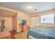 Cozy bedroom featuring hardwood floors, a large window, and ample closet space at 2700 Brienza Way, Las Vegas, NV 89117