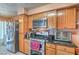 The kitchen features updated appliances, granite countertops and ample cabinet space at 2700 Brienza Way, Las Vegas, NV 89117