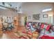 Cozy living room with laminate floors, dining area, high ceilings, and comfortable seating at 2700 Brienza Way, Las Vegas, NV 89117