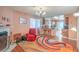 Cozy living room features a fireplace, wood floors and a breakfast bar that opens to the kitchen at 2700 Brienza Way, Las Vegas, NV 89117