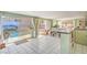 Bright living space with tile floors, wet bar, access to the pool, and backyard views at 2700 Brienza Way, Las Vegas, NV 89117