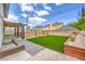 Charming backyard patio with a privacy fence and lush lawn, ideal for outdoor gatherings and tranquil relaxation at 2834 Natalie Ave, Las Vegas, NV 89121
