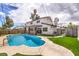 Refreshing backyard pool surrounded by lush landscaping, creating a private oasis for summer fun and relaxation at 2834 Natalie Ave, Las Vegas, NV 89121
