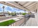 Inviting balcony view overlooking the front yard with manicured lawn and a covered parking area, perfect for enjoying the outdoors at 2834 Natalie Ave, Las Vegas, NV 89121