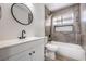 This remodeled bathroom has a shower and tub combo with modern fixtures at 2834 Natalie Ave, Las Vegas, NV 89121