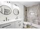 Updated bathroom featuring double sinks and a modern tiled shower at 2834 Natalie Ave, Las Vegas, NV 89121