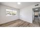 This bedroom offers a neutral color palette and wood-look flooring at 2834 Natalie Ave, Las Vegas, NV 89121
