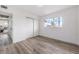 This bedroom features wood-look flooring and a closet with sliding doors at 2834 Natalie Ave, Las Vegas, NV 89121
