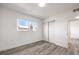 This bright bedroom features wood-look flooring and a large window at 2834 Natalie Ave, Las Vegas, NV 89121